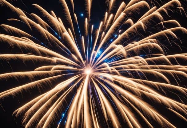 Fireworks burst over Libertyville, illuminating the night sky with vibrant colors and cascading sparks. Crowds gather, gazing in awe at the dazzling display